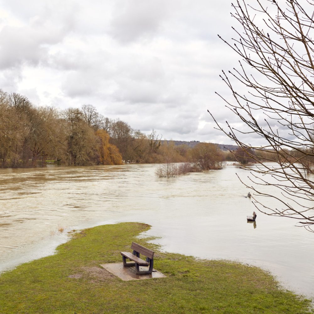 Benches Submerged As River Thames Floods And Bursts In Banks In UK